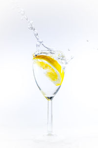 Close-up of wine glass against white background