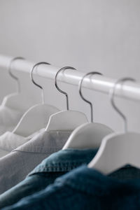 Close-up of clothes hanging on rack