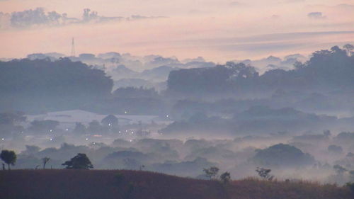 Scenic view of landscape against cloudy sky