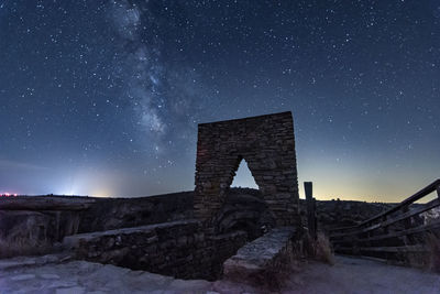 Low angle view of building against sky at night