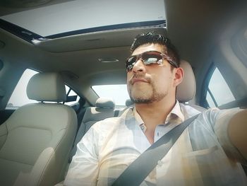 Man sitting in car