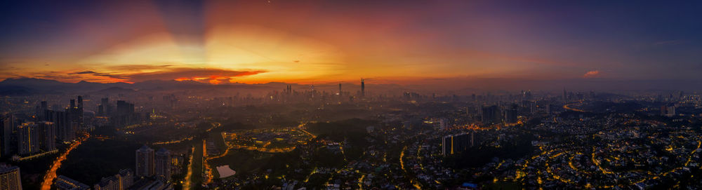 Aerial view of city during sunset