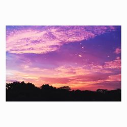 Scenic view of landscape against sky at sunset