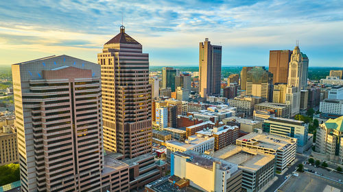 Buildings in city against sky