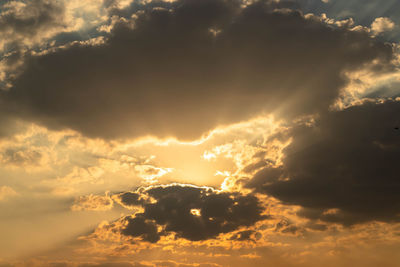 Low angle view of clouds in sky during sunset