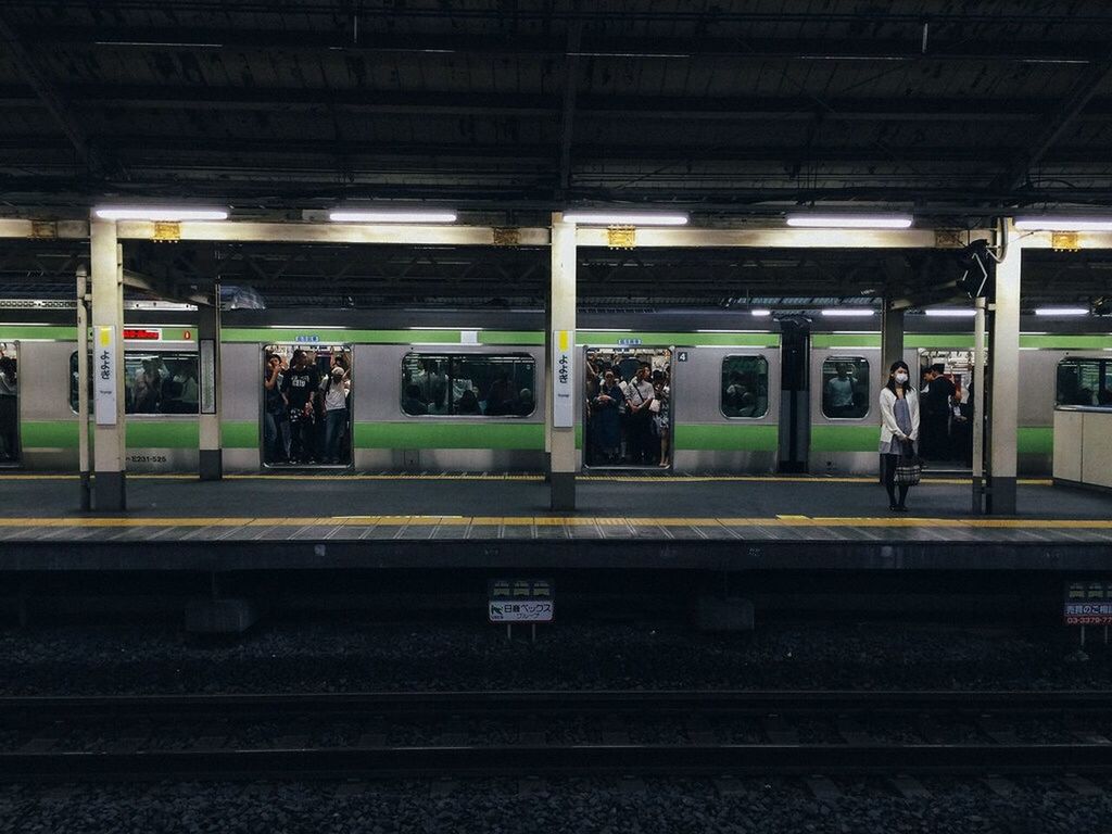 railroad station platform, public transportation, railroad track, railroad station, transportation, rail transportation, train - vehicle, mode of transport, passenger train, travel, public transport, train, indoors, railway station, subway station, railway station platform, passenger, journey, incidental people, station