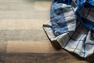 High angle view of towel on floorboard