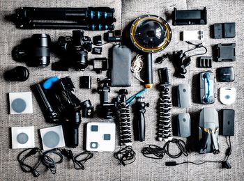 Directly above shot of photographic equipment on table