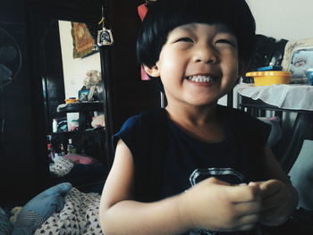 Portrait of smiling boy at home