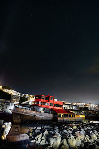 Illuminated buildings in city at night