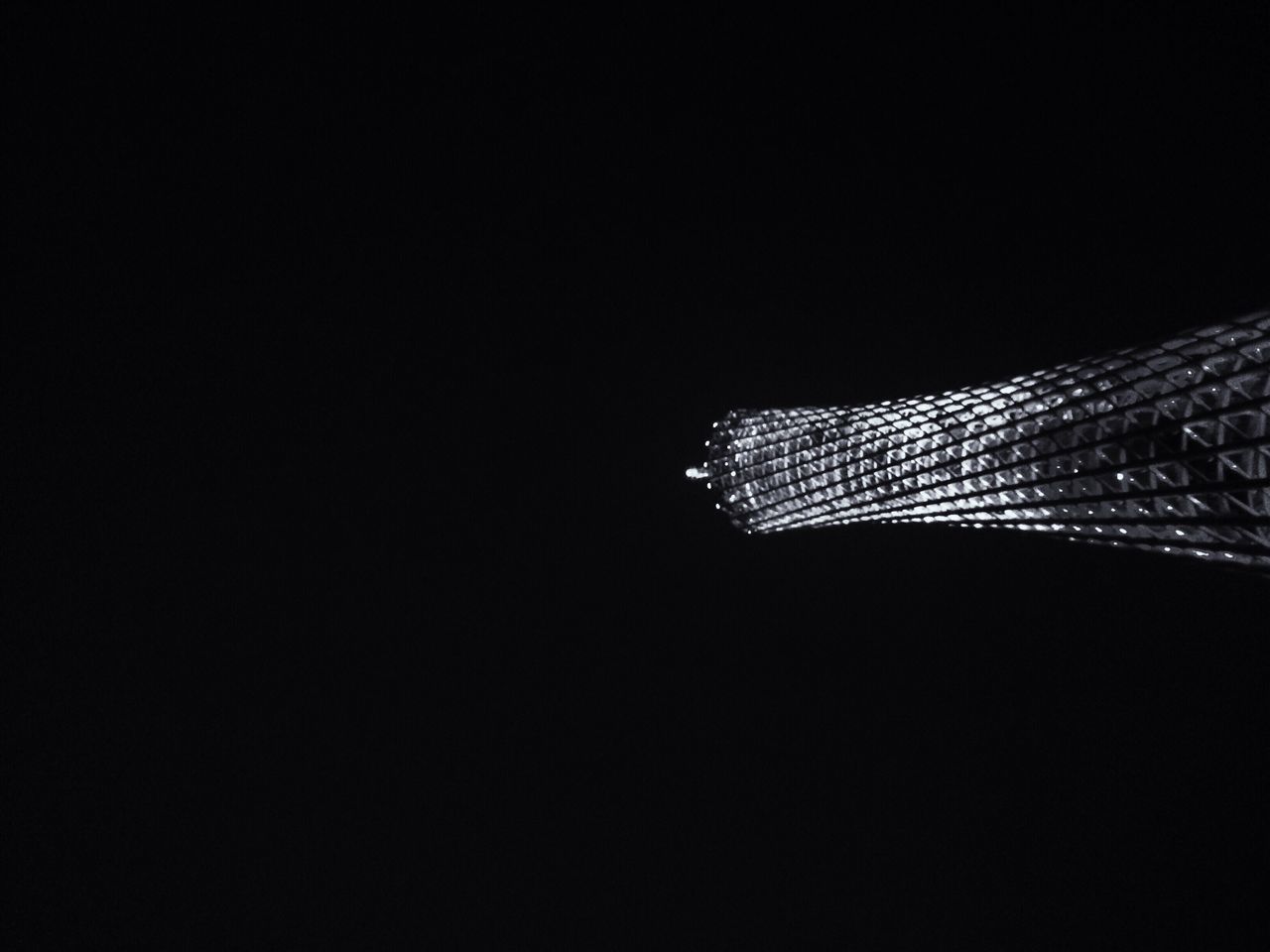 copy space, studio shot, black background, night, architecture, dark, clear sky, pattern, built structure, low angle view, no people, building exterior, design, close-up, modern, indoors, abstract, textile, textured