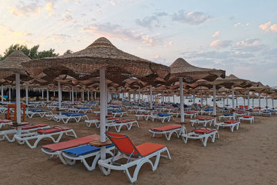 Scenic view of beach against sky during sunset