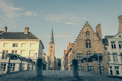 Flemish buildings in brugge city against sky