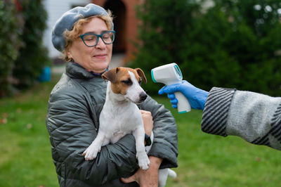 Full length of woman with dog