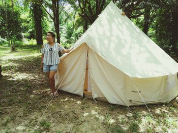 Man standing in tent