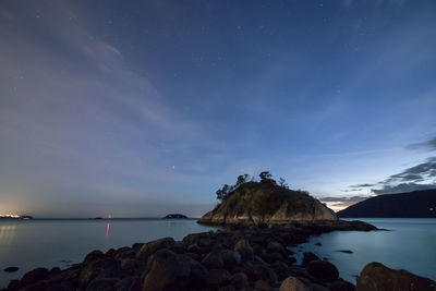 Scenic view of sea against sky at night