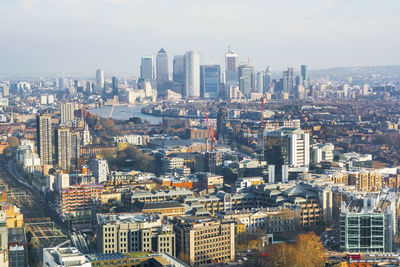 High angle view of buildings in city against sky