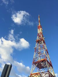 Low angle view of communications tower against sky