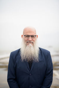 Portrait of smiling man standing outdoors