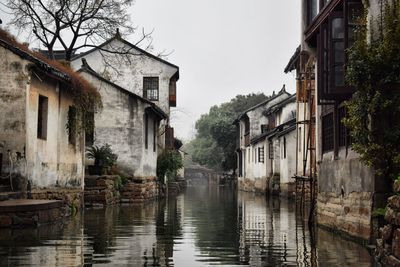 Canal amidst buildings in city