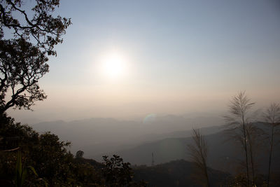 Scenic view of silhouette mountains against sky at sunset