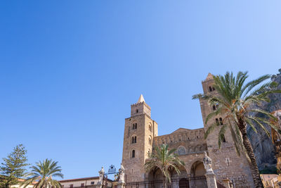 Low angle view of building against blue sky