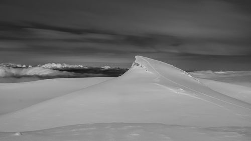 Snow covered mountain against sky