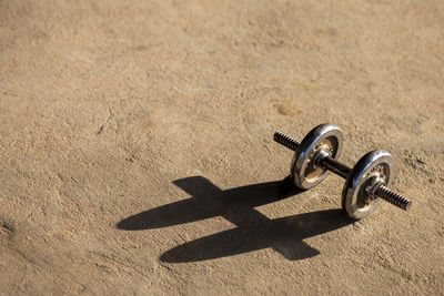 High angle view of metal object on sand