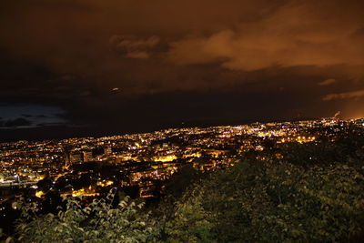 High angle view of illuminated buildings in city at night