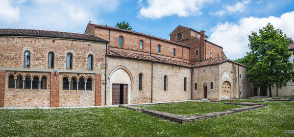 Facade of historic building against sky