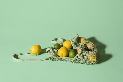 Close-up of fruits in basket on table