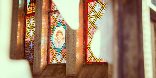 Close-up of abandoned room seen through window 