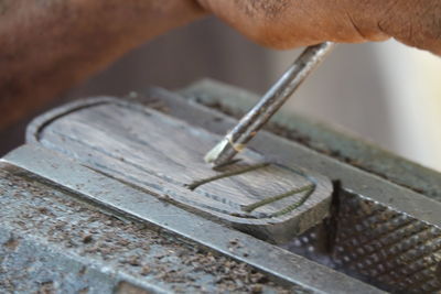 Cropped hand carving wood