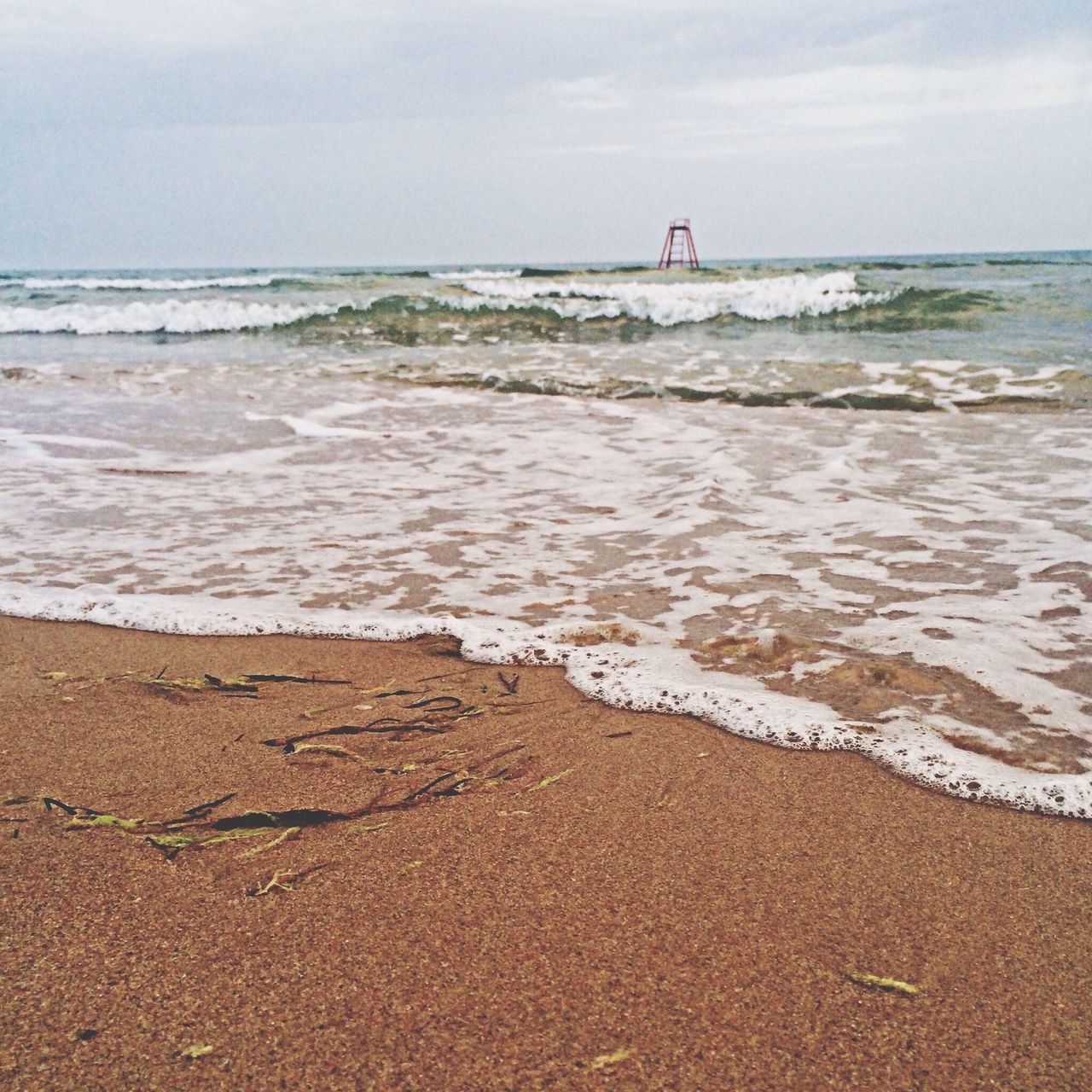 sea, beach, horizon over water, water, sand, shore, sky, wave, tranquil scene, tranquility, scenics, beauty in nature, surf, nature, coastline, idyllic, remote, seascape, calm, day