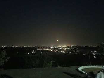 Illuminated cityscape at night