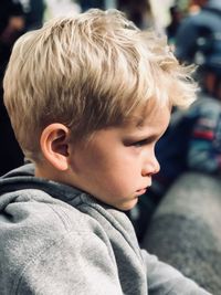 Close-up portrait of boy looking away outdoors