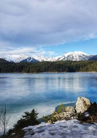 Scenic view of frozen lake against sky