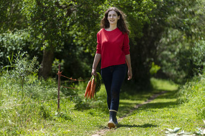 Portrait of young woman walking outdoors