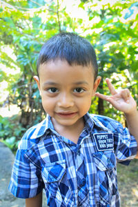 Portrait of smiling boy gesturing