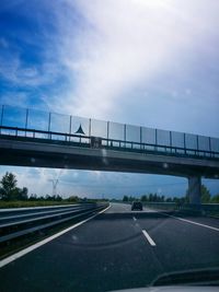 View of bridge against cloudy sky