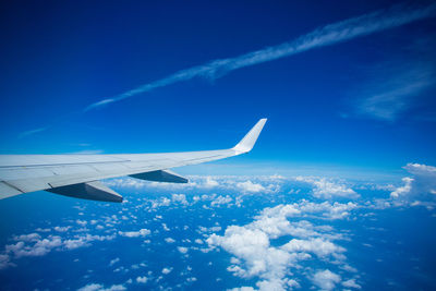 Aerial view of vapor trail in sky