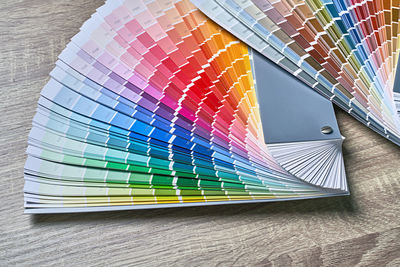 High angle view of multi colored book on table