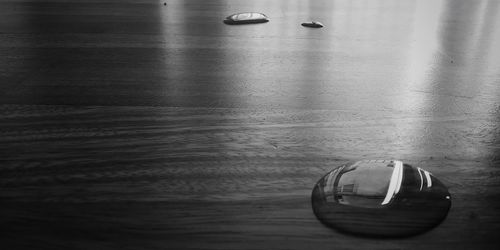 Close-up of glass container on table