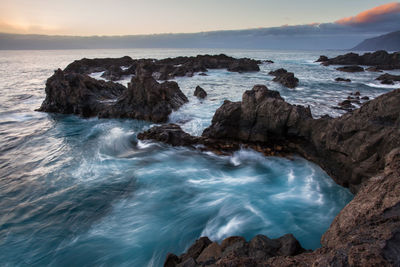 Scenic view of sea against sky during sunset