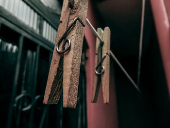 Close-up of clothespins hanging on clothesline