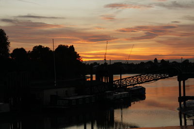 Silhouette trees against sky during sunset