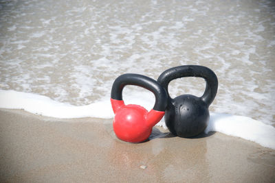 High angle view of kettlebells at beach