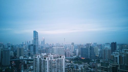 Modern buildings in city against sky