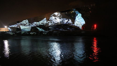 Reflection of illuminated buildings in water