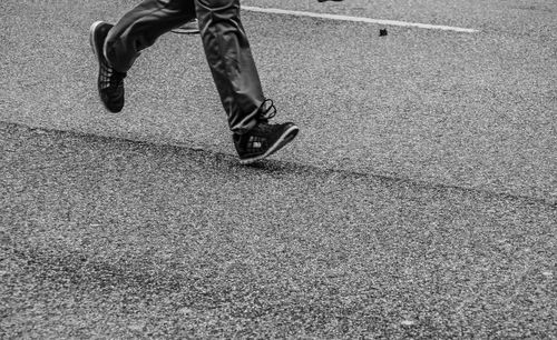 Low section view of person running on road